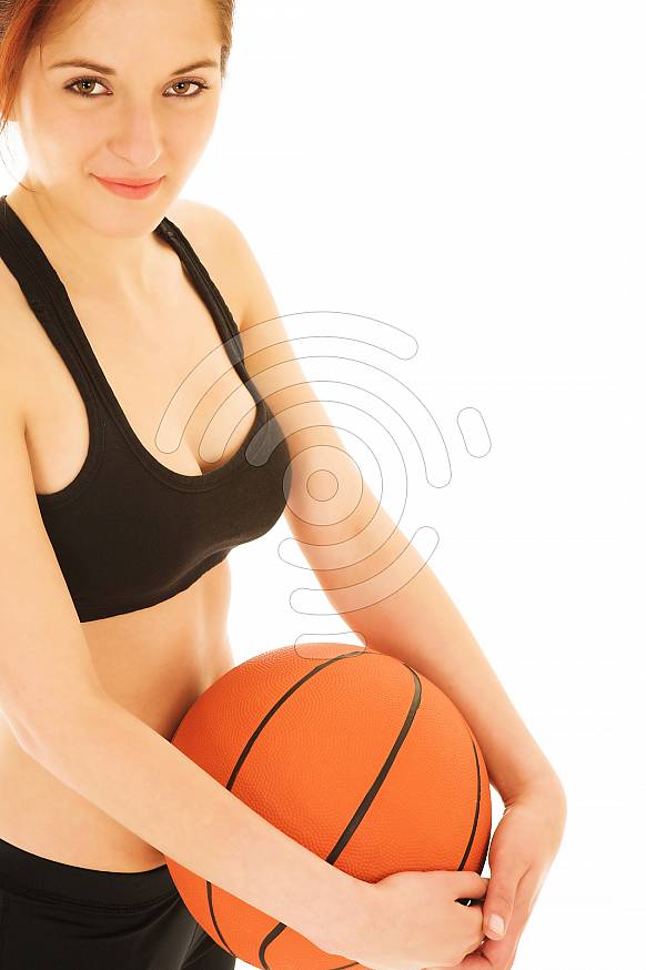 Girl in black crop top with basketball