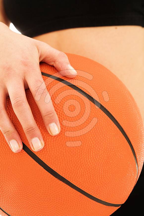 Hand on basketball